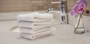 folded white towels in bathroom